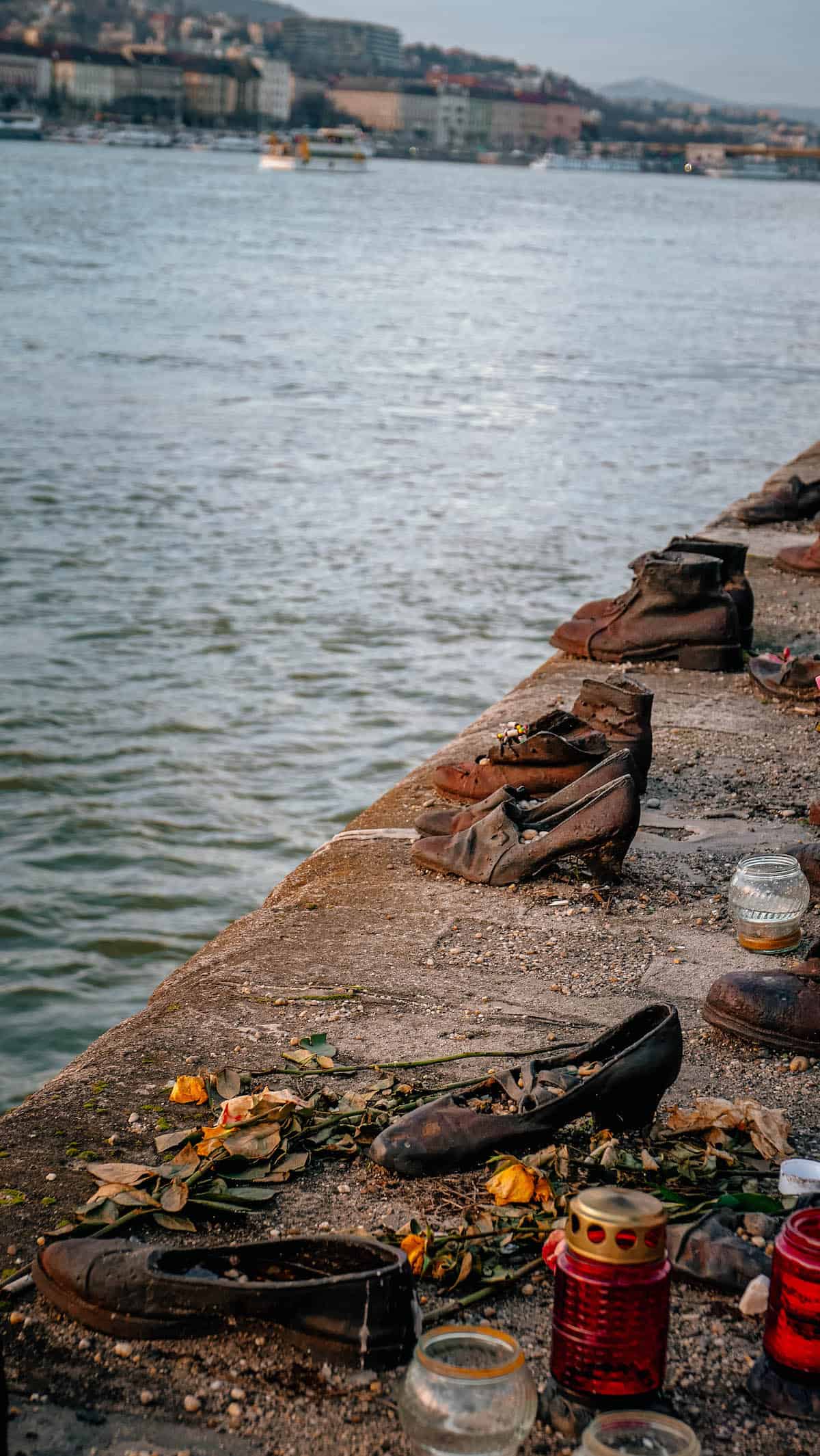 A group of shoes on the side of a river.