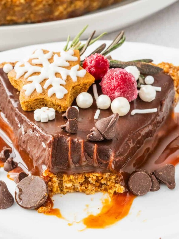 A slice of Chocolate Gingerbread Tart on a plate.