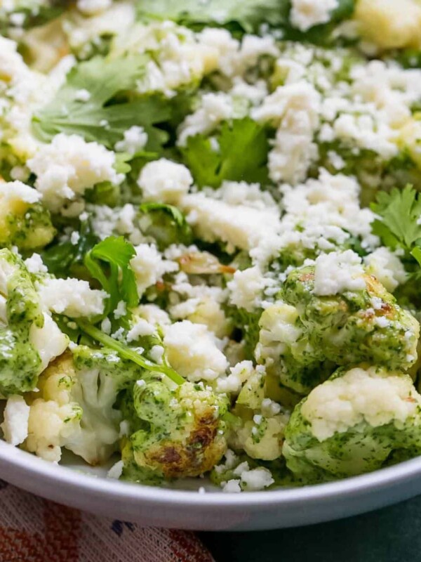 cauliflower in cashew pesto in a white bowl