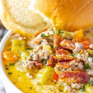 A bowl of chicken noodle soup with bacon and vegetables, easy cheeseburger soup recipe.