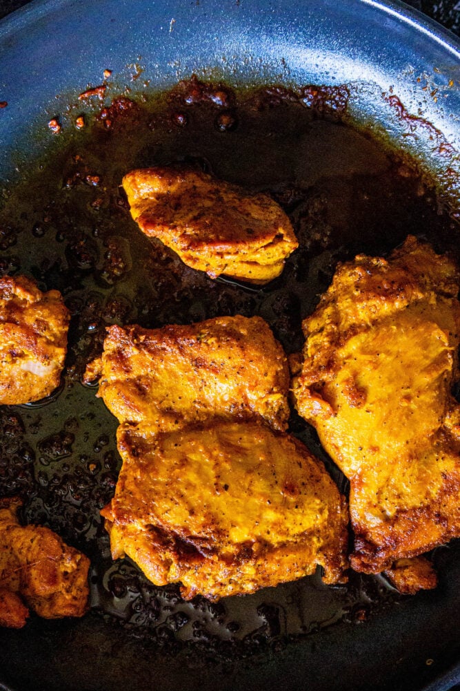 chicken thighs in a pan