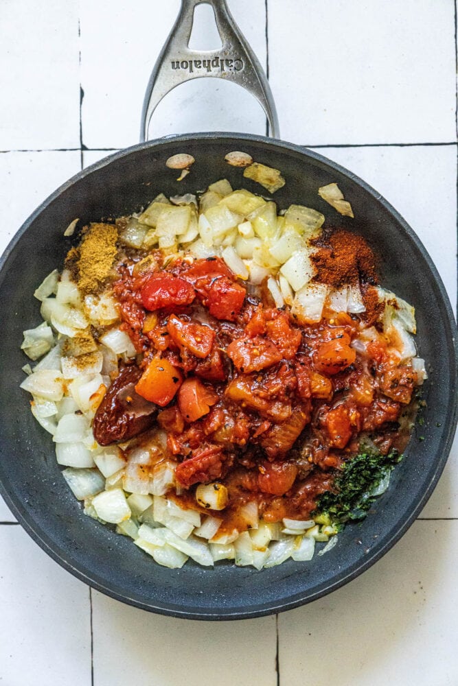 diced tomatoes, adobo peppers, onion, oregano, chili powder, cumin, and garlic in a pan 