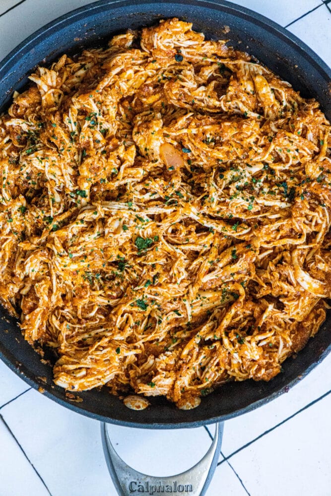 shredded chicken tinga in a pan 