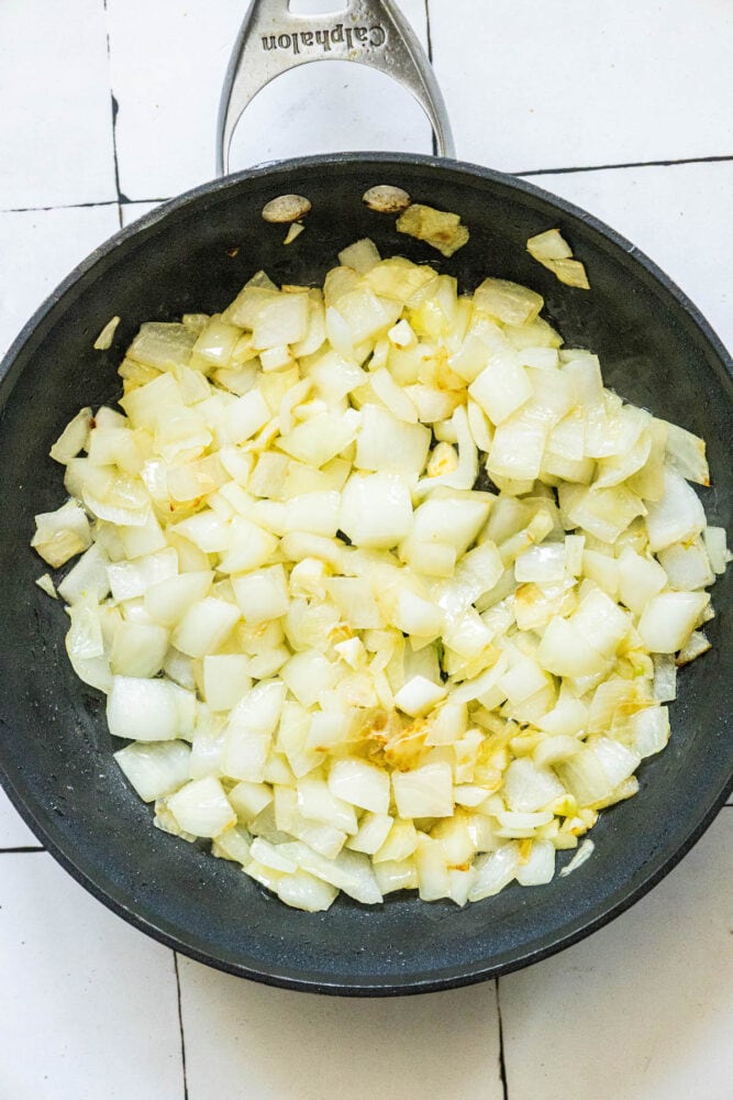 onion and garlic browning in a pan 