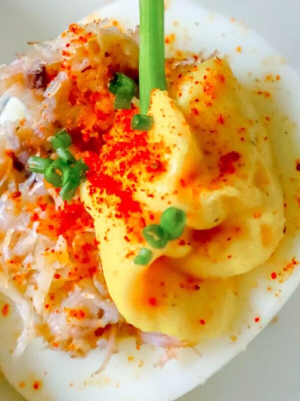 egg with creamed yoke, crab, and green onions on it