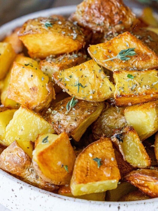 picture of roasted potatoes in a bowl with herbs and butter