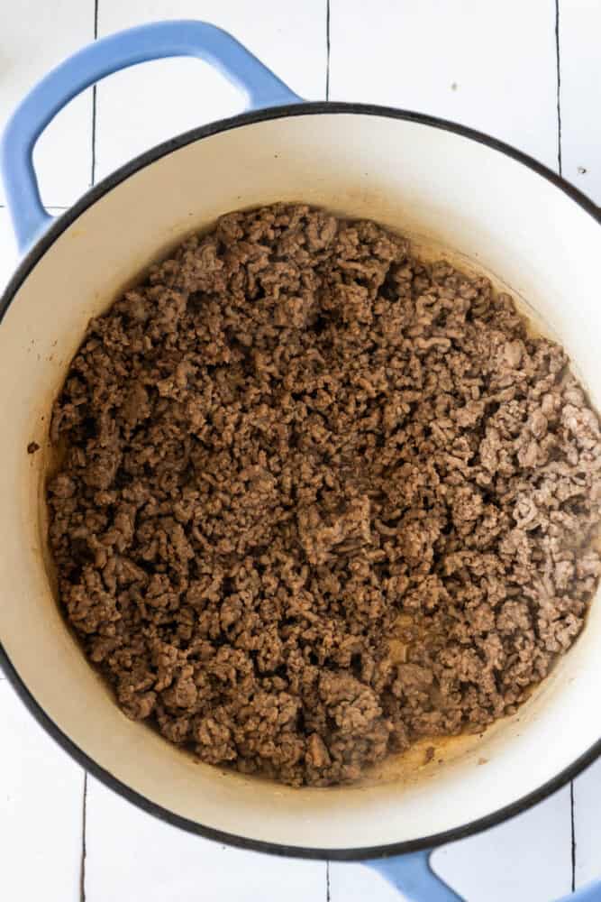 Ground beef on a wooden table.