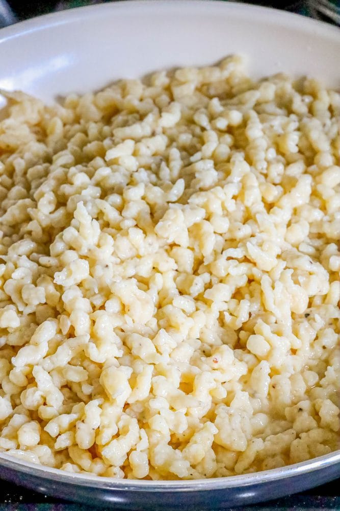 spaetzle in a pan with butter frying