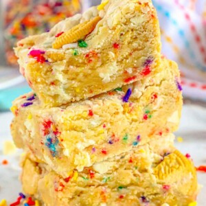 funfetti cookie bars stacked on top of each other on a table