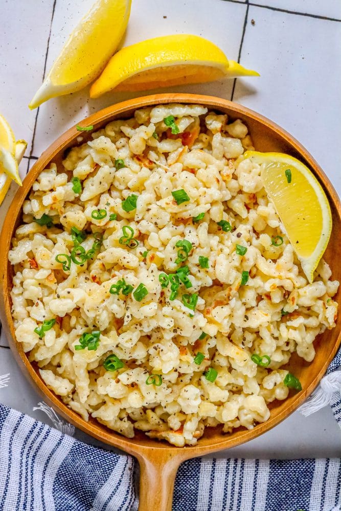 spaetzle in a wood dish on a table