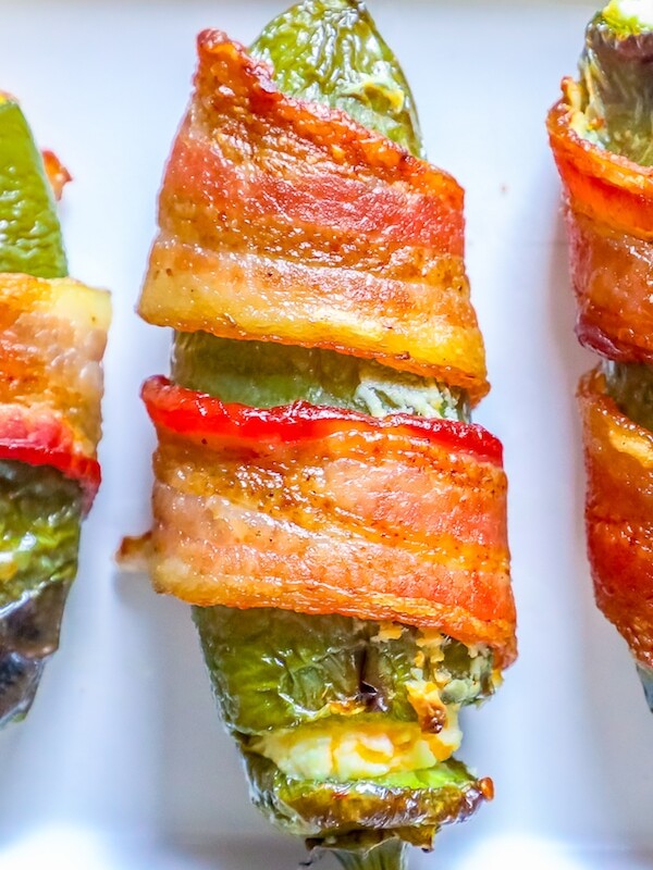 picture of bacon wrapped jalapeno poppers on a plate