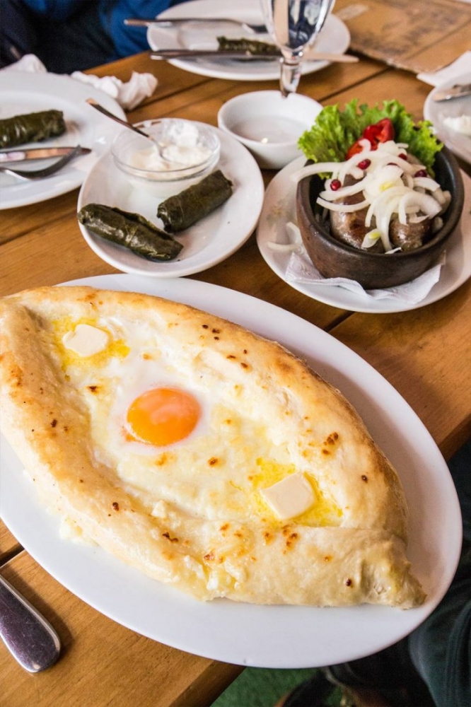 khachaupuri on a plate in a cafe in tbilisi 