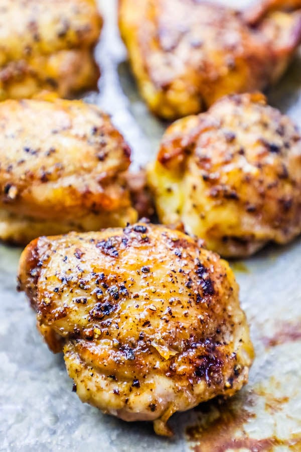 crispy ranch baked chicken thigh on baking sheet. 