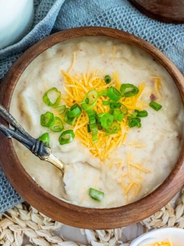 potato soup with a spoon in it