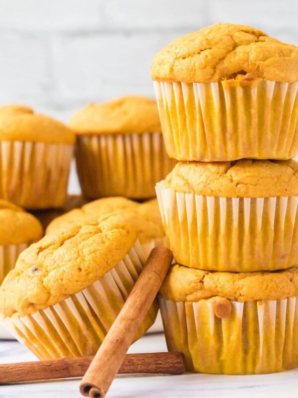 picture of pumpkin spice muffins stacked on a table