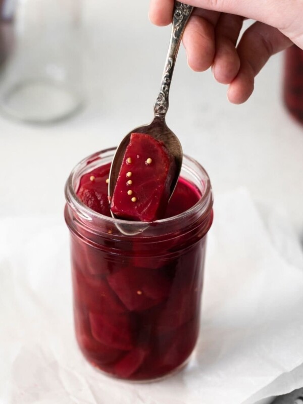 picture of pickled beets in a jar with a spoon