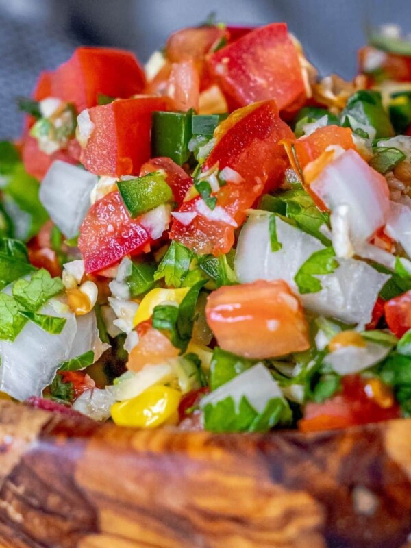 picture of spicy corn pico de gallo in a wooden bowl