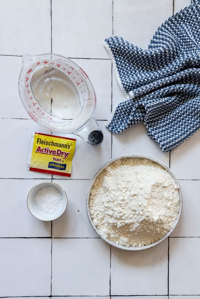 picture of yeast, water, salt, flour on a table