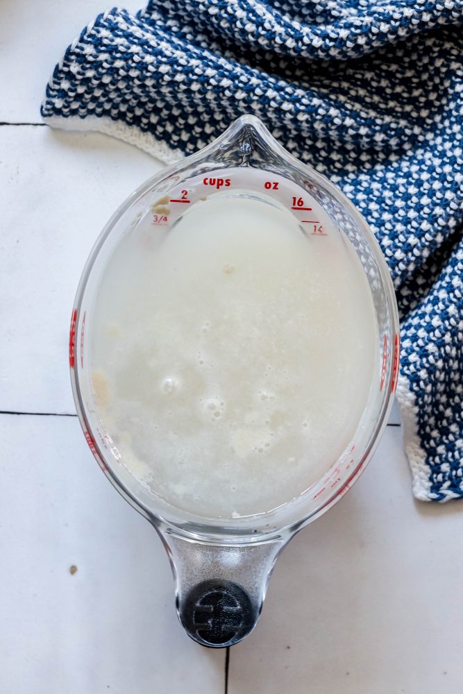 picture of yeast proofing in water in measuring cup