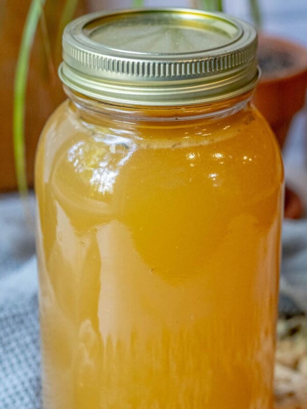 Honey and slow cooker on a table.